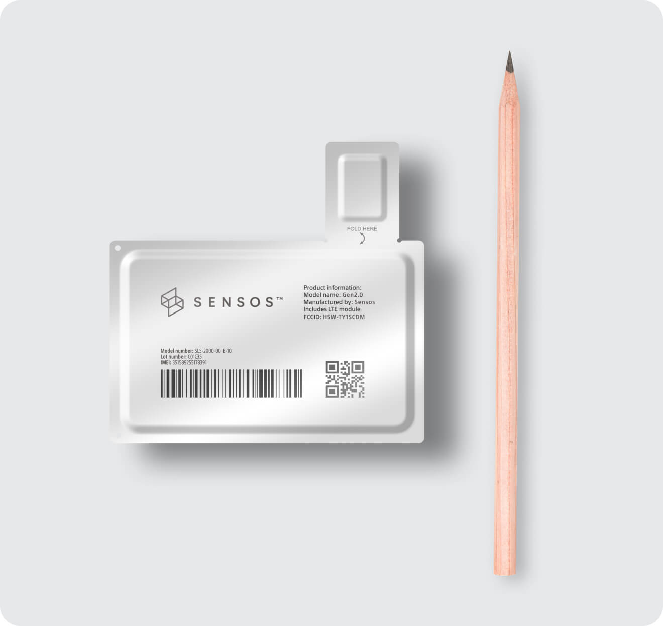 A plastic card with a pencil next to it.